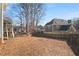 Large backyard with a fenced area and mature trees at 5659 Brookstone Nw Dr, Acworth, GA 30101