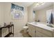 Cozy bathroom featuring a vanity, sink, and a framed window at 5659 Brookstone Nw Dr, Acworth, GA 30101