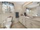 Elegant bathroom with double sinks, white marble countertops, and a linen closet at 5659 Brookstone Nw Dr, Acworth, GA 30101