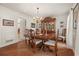 Formal dining room featuring hardwood floors and a wooden table set at 5659 Brookstone Nw Dr, Acworth, GA 30101