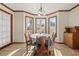 Charming dining room featuring a bay window and a classic wooden table set at 5659 Brookstone Nw Dr, Acworth, GA 30101