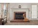 Brick fireplace with white mantel in living room at 5659 Brookstone Nw Dr, Acworth, GA 30101