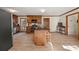 A view of the kitchen with wood cabinets, an island, and stainless steel appliances at 5659 Brookstone Nw Dr, Acworth, GA 30101