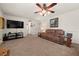 Spacious living room with hardwood floors and large TV at 5659 Brookstone Nw Dr, Acworth, GA 30101