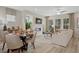 Bright dining area with a round table and four chairs, adjacent to a kitchen and living room at 6243 Kenbrook Dr, Tucker, GA 30084