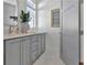 Light and bright bathroom with gray vanity and marble flooring at 190 Rolison Way, Fayetteville, GA 30214