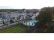 Aerial view of community pool with surrounding houses and green space at 190 Rolison Way, Fayetteville, GA 30214