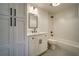 Modern bathroom with white cabinets, marble countertop, and subway tile shower at 2439 Woodridge Dr, Decatur, GA 30033