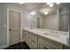 Spa-like bathroom with double vanity, marble countertops, and hexagon tile floor at 2439 Woodridge Dr, Decatur, GA 30033