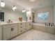 Elegant bathroom with double vanity, marble countertops, and a soaking tub at 2439 Woodridge Dr, Decatur, GA 30033