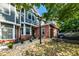 Attractive two-story townhome with gray siding, brick accents, and a landscaped front yard at 2680 Pine Tree Ne Rd # 2, Atlanta, GA 30324