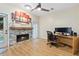 Living room features a fireplace, large window, and ceiling fan at 2680 Pine Tree Ne Rd # 2, Atlanta, GA 30324