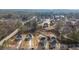 Wide aerial view of community and highlighted home at 4420 Ross Estates Ct, Snellville, GA 30039