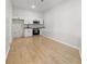 Basement kitchenette with white cabinets and stainless steel appliances at 4420 Ross Estates Ct, Snellville, GA 30039