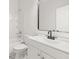 Modern bathroom with white vanity, black fixtures and marble floor at 4420 Ross Estates Ct, Snellville, GA 30039