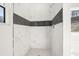 Walk-in shower with marble tile and a built-in niche at 4420 Ross Estates Ct, Snellville, GA 30039