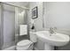 Clean bathroom with pedestal sink and shower at 6442 Canopy Dr, Sandy Springs, GA 30328