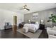 Comfortable bedroom with neutral colors, large bed, and stylish accents at 6442 Canopy Dr, Sandy Springs, GA 30328