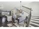 Open dining area with modern light fixture and hardwood floors at 6442 Canopy Dr, Sandy Springs, GA 30328