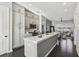 Modern kitchen with island, stainless steel appliances, and dark hardwood floors at 6442 Canopy Dr, Sandy Springs, GA 30328