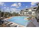 Inviting community pool with plenty of lounge chairs for relaxation at 6442 Canopy Dr, Sandy Springs, GA 30328