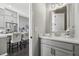 Elegant powder room with a quartz countertop vanity at 6442 Canopy Dr, Sandy Springs, GA 30328