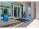 Modern building entrance with glass doors and large planters at 3300 Windy Ridge Se Pkwy # 1603, Atlanta, GA 30339