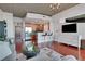 Open living room features hardwood floors and city views at 3300 Windy Ridge Se Pkwy # 1603, Atlanta, GA 30339