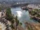 Aerial view of a lakefront community with houses and lush green trees at 2777 Lakeview Walk, Decatur, GA 30035