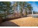 Backyard with a view of a lake and wooded area at 2777 Lakeview Walk, Decatur, GA 30035