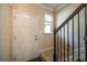 Front entry with staircase and dark wood handrail at 2777 Lakeview Walk, Decatur, GA 30035