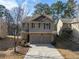 Two-story house with two-car garage, stone accents and a basketball hoop at 2777 Lakeview Walk, Decatur, GA 30035