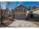 Two-story house with two-car garage, stone accents and a basketball hoop at 2777 Lakeview Walk, Decatur, GA 30035