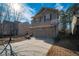 Two-story house with a two-car garage and a basketball hoop in the yard at 2777 Lakeview Walk, Decatur, GA 30035