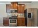 Stainless steel appliances and dark wood cabinets in the kitchen at 2777 Lakeview Walk, Decatur, GA 30035