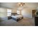 Spacious main bedroom with high ceilings, king bed, and multiple windows at 2777 Lakeview Walk, Decatur, GA 30035