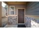 Side entrance with stone accents and a brown door at 2777 Lakeview Walk, Decatur, GA 30035