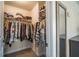 Large walk-in closet with ample shelving and hanging space at 2777 Lakeview Walk, Decatur, GA 30035