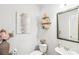 Stylish powder room with a pedestal sink and decorative accents at 3216 Colchester St, Douglasville, GA 30135