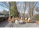 Stone firepit surrounded by wooden chairs at 3216 Colchester St, Douglasville, GA 30135