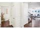 Bright hallway with hardwood floors and views into living room at 3216 Colchester St, Douglasville, GA 30135