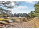 Serene pond with a fountain and wooden footbridge at 3216 Colchester St, Douglasville, GA 30135