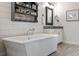 Spa-like bathroom featuring a freestanding soaking tub and shiplap feature wall at 364 Concord St, Alpharetta, GA 30009