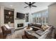 Spacious living room with a white brick fireplace and large windows at 364 Concord St, Alpharetta, GA 30009