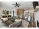 Open-concept living area with L-shaped sofa and exposed brick feature wall at 364 Concord St, Alpharetta, GA 30009