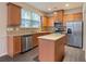 Modern kitchen with stainless steel appliances and granite countertops at 3879 Brockenhurst Dr, Buford, GA 30519