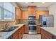 Kitchen with stainless steel appliances and granite countertops at 3879 Brockenhurst Dr, Buford, GA 30519