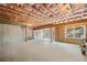 Unfinished basement with exposed ceiling beams and concrete floor, ready for customization at 522 Spring View Dr, Woodstock, GA 30188