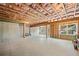 Unfinished basement with exposed framing and concrete floor at 522 Spring View Dr, Woodstock, GA 30188