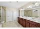 Elegant bathroom with double vanity, large mirror, and tiled floor at 522 Spring View Dr, Woodstock, GA 30188